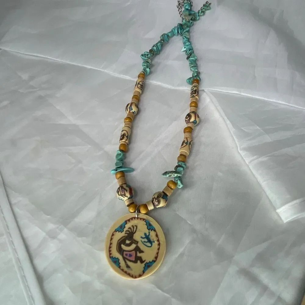 Vintage turquoise clay and carved beaded Kokopelli necklace handpainted.